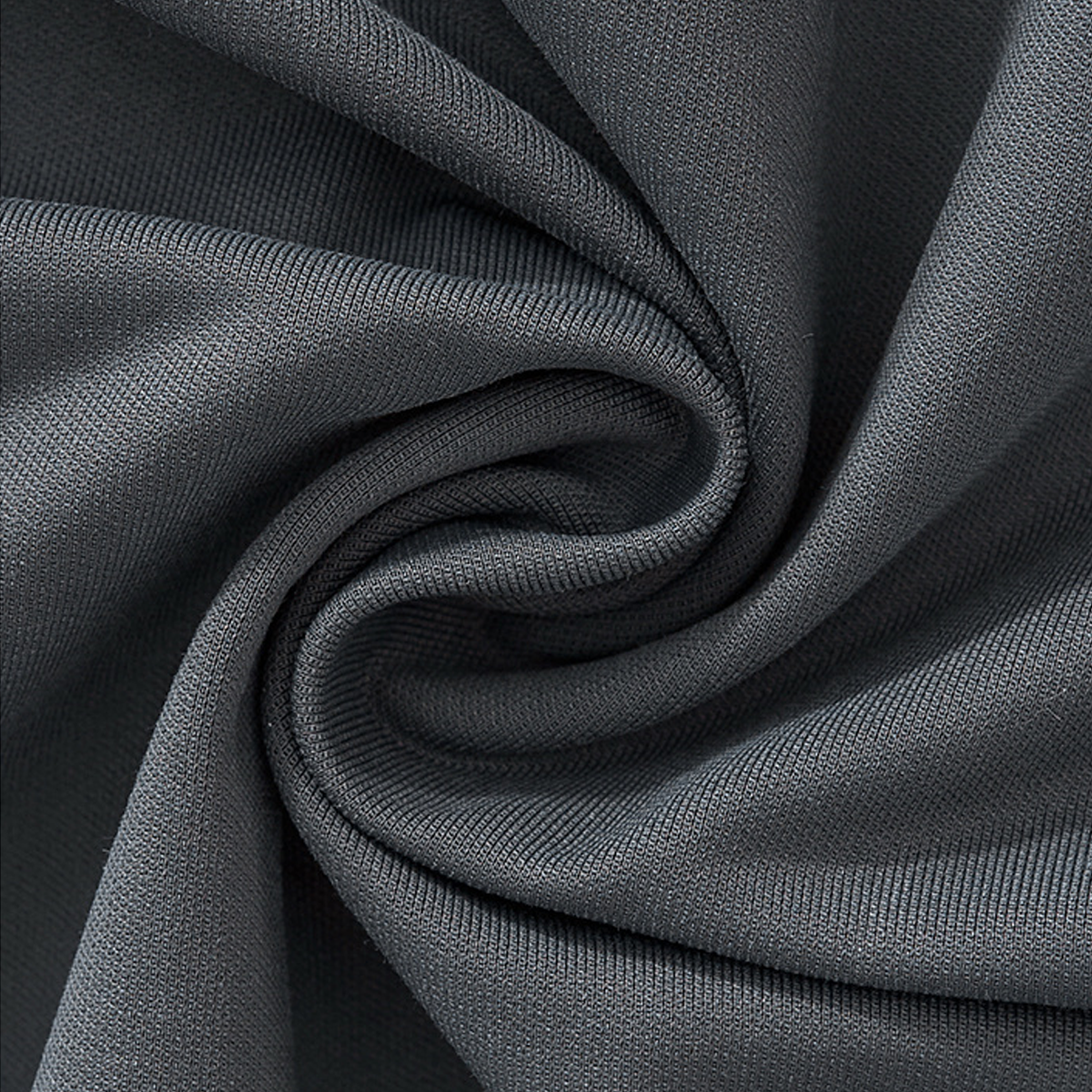 Close-up of soft gray fabric swirl, showcasing texture for Dripping in Favor Colorblock V-neck Long Sleeve Shirt.